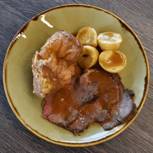roast beef, potatoes and a large yorkshire pudding